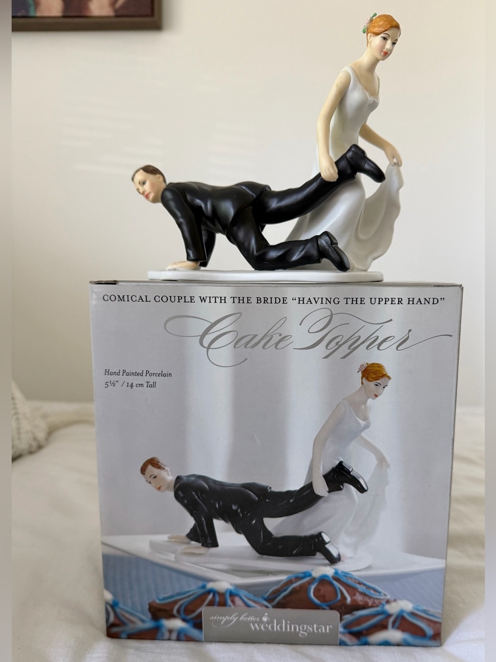 Comical Wedding Cake Topper - Bride Holding Groom Funny Porcelain